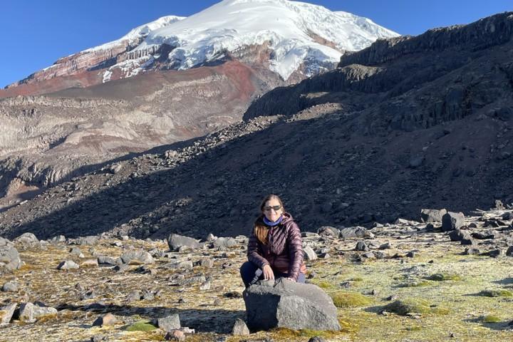 加州大学洛杉矶分校 Professor Jennifer Garrison sits in front of a large mountain.